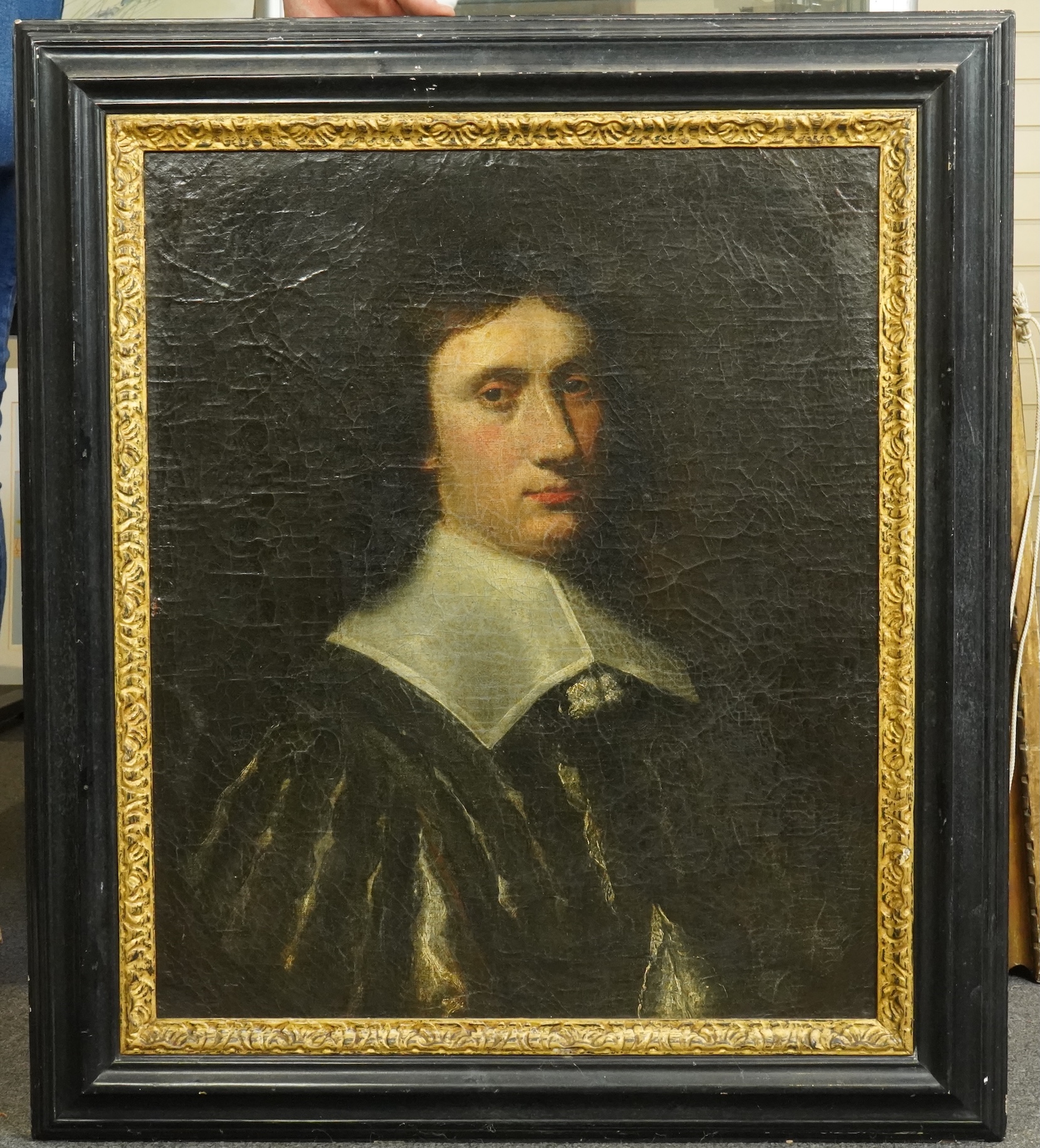 Follower of Pieter Nason (Dutch, 1612-1688), Half length portrait of a gentleman wearing a black slashed doublet, oil on canvas, 65 x 55cm